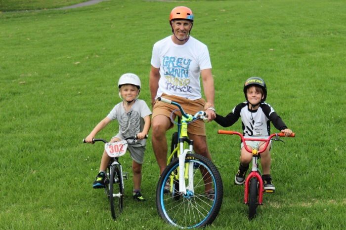 Paul Wacker and his two sons at the site of the proposed Grey Lynn Park BMX pump track. Photo: Andrew Hallberg.